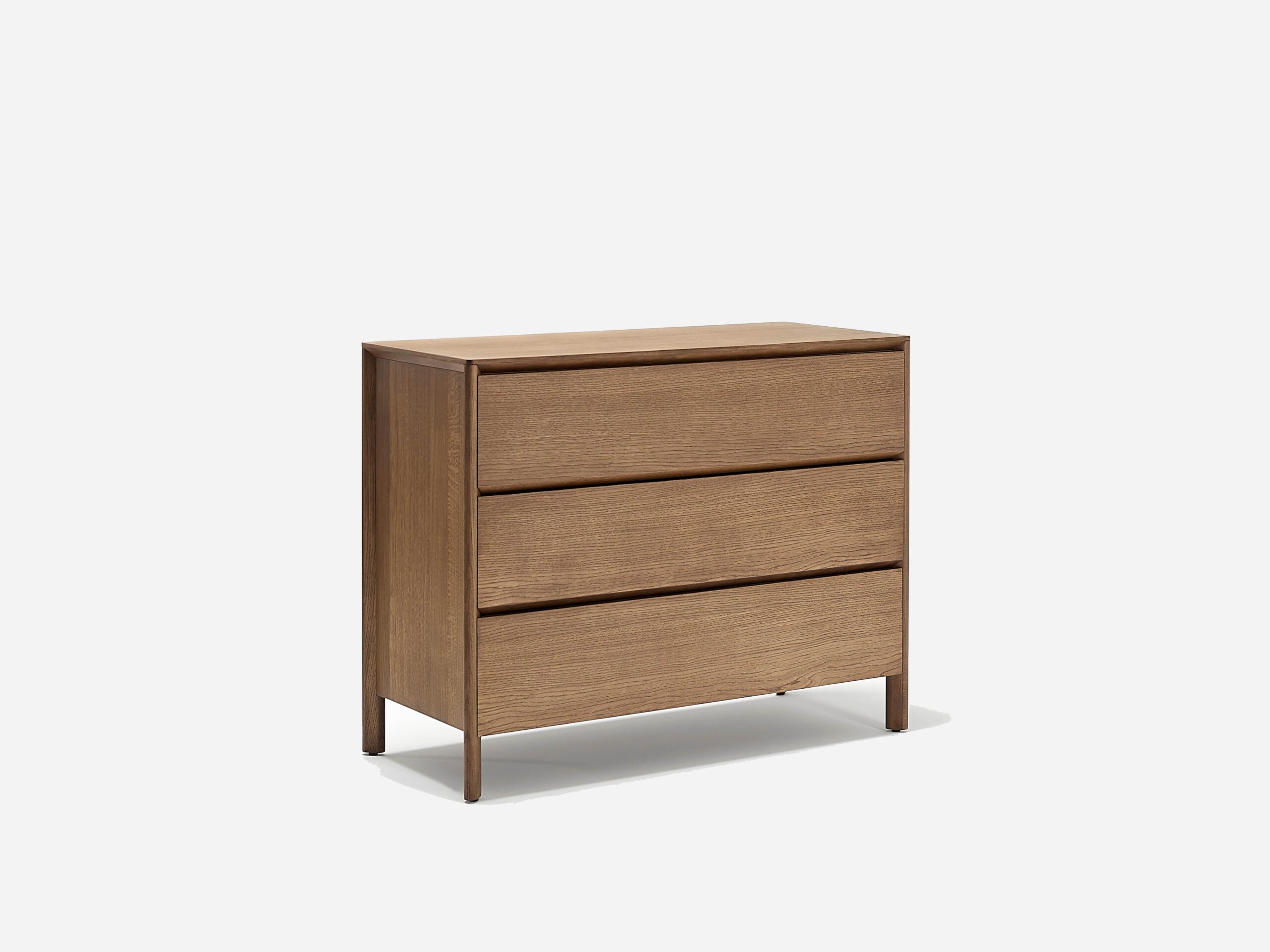 A modern wooden dresser with three horizontal drawers, featuring a minimalist design and a natural brown finish, standing on four short legs against a plain white background.
