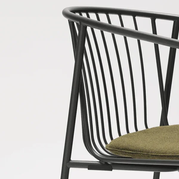 Close-up of a modern black metal chair with vertical slats and an olive green fabric seat cushion, set against a plain white background.